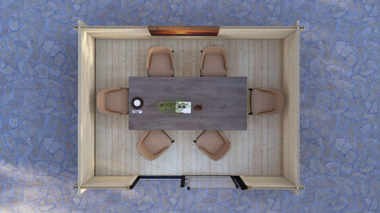 Top-down view of a dining area with a table and chairs on a textured blue floor. Low threshold and tongue and groove timber floor inside Dean modern log cabin with sliding doors